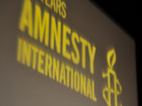            ,     Amnesty International